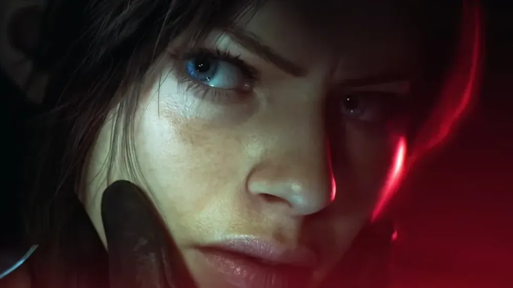 A close-up of Claire Redfield bathed in red light from the Resident Evil Code: Veronica remake reveal.