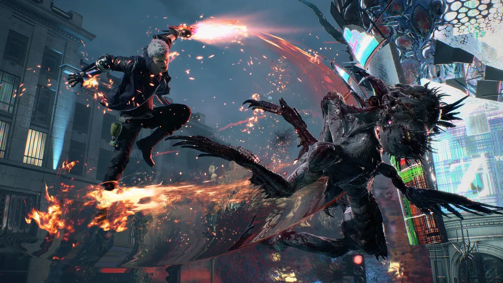 Nero attacks a demon with a flaming mechanical arm in an official Devil May Cry 5 screenshot.
