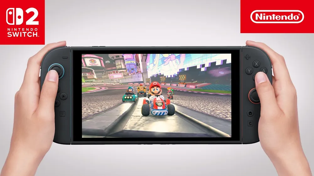 Two hands hold a Nintendo Switch 2 displaying a Mario Kart race.