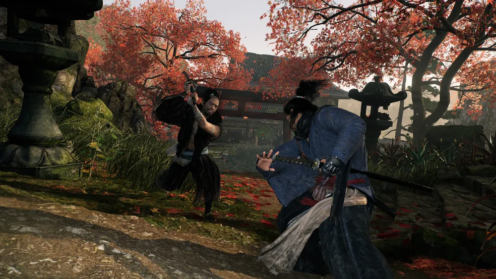 Two swordsmen clash beneath red autumn leaves in an official Rise of the Ronin gameplay screenshot.