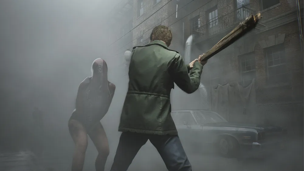 James Sunderland stands in a dim, decayed interior in Silent Hill 2.