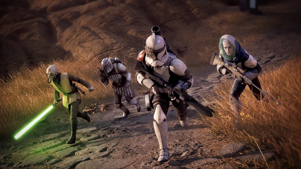 A Jedi, clone troopers, and two operatives advance together across rocky terrain in Star Wars Zero Company.