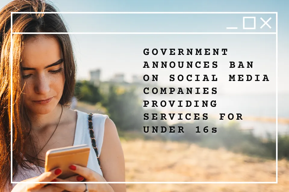 A UK government graphic showing a young woman using a phone beside text announcing a social-media ban for under-16s.