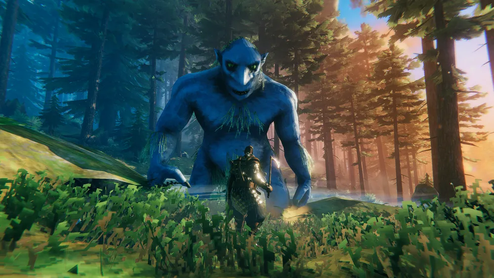 A Valheim viking standing face to face with a giant troll.