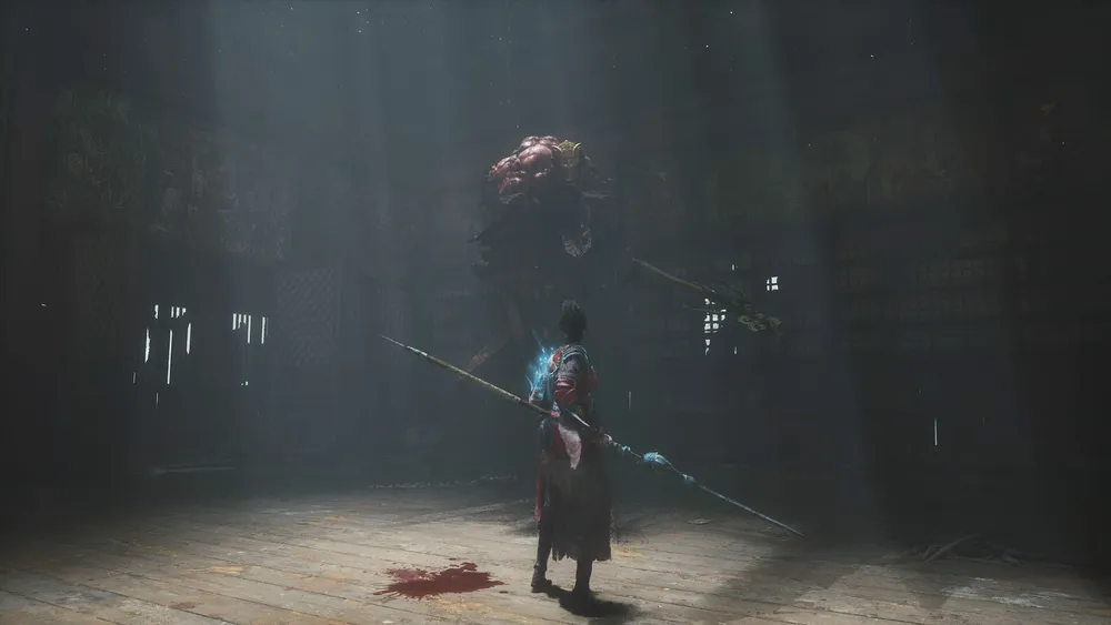 The Wuchang protagonist holds a long spear beneath a large creature suspended in a dark chamber.